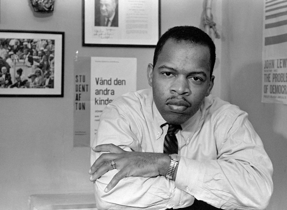 John Lewis smiling at his desk